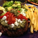 bunless burger with pesto, goat cheese, and roasted peppers