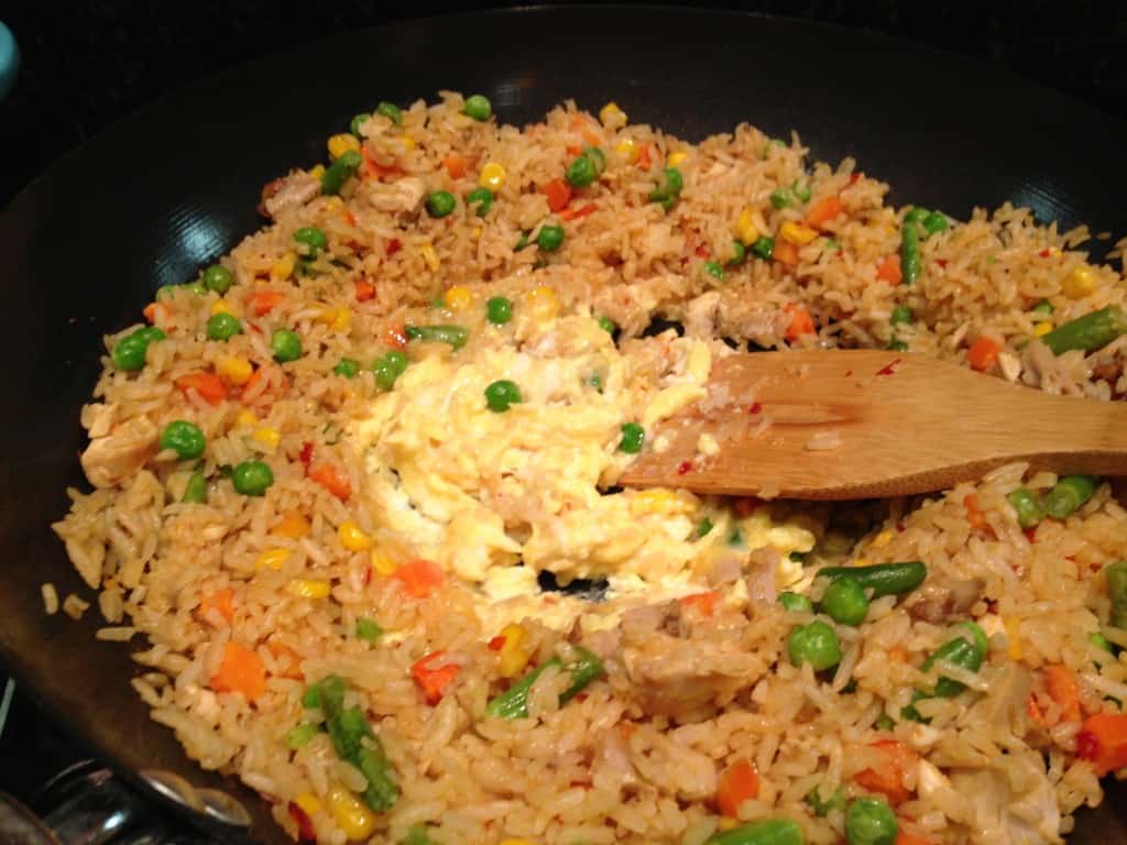 Adding egg to the fried rice