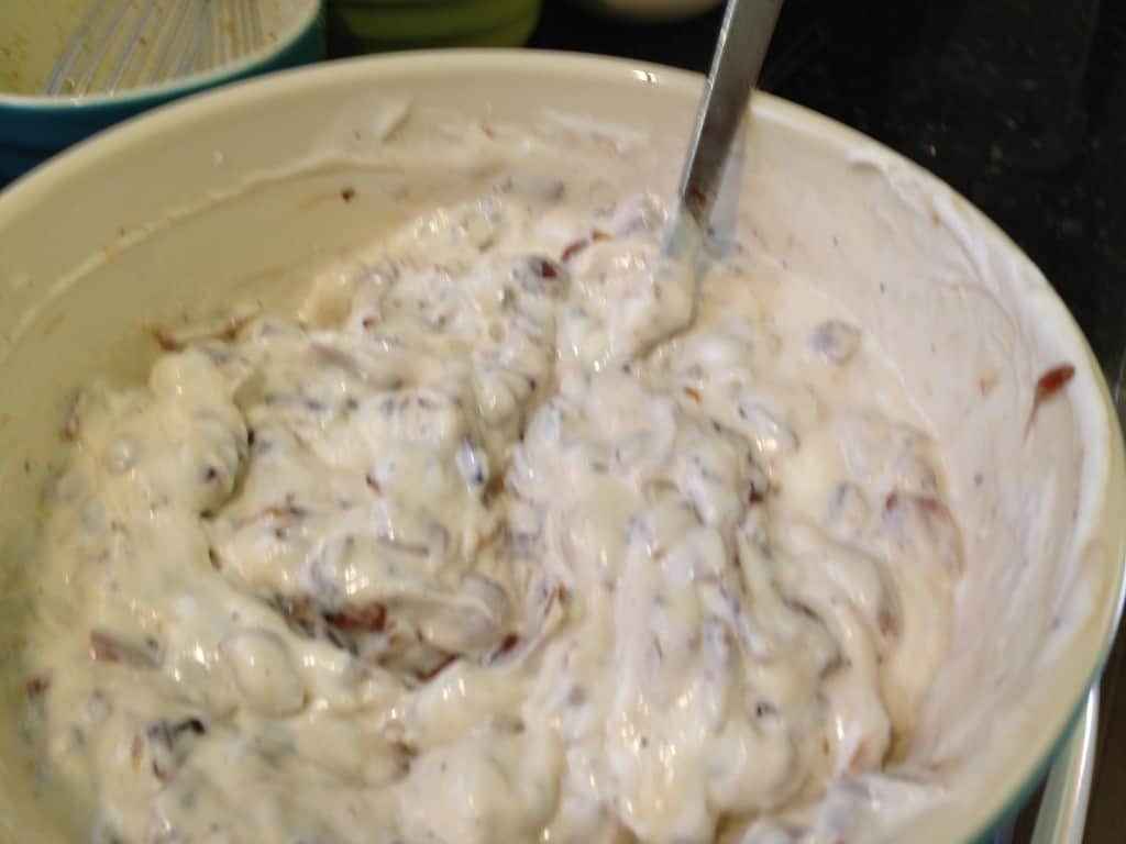 Mixing the ingredients for dip together