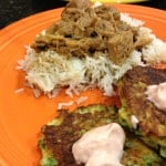 Chicken adobo with a side of zucchini fritters.