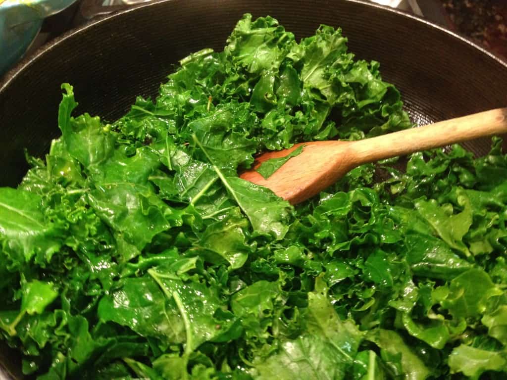 Wilting the kale for a salad.