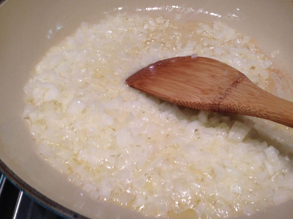 Cook the onions in butter until soft.