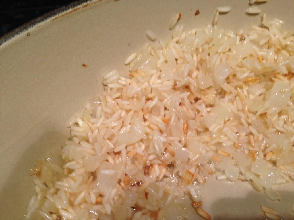 Saute the rice in butter before adding the liquid